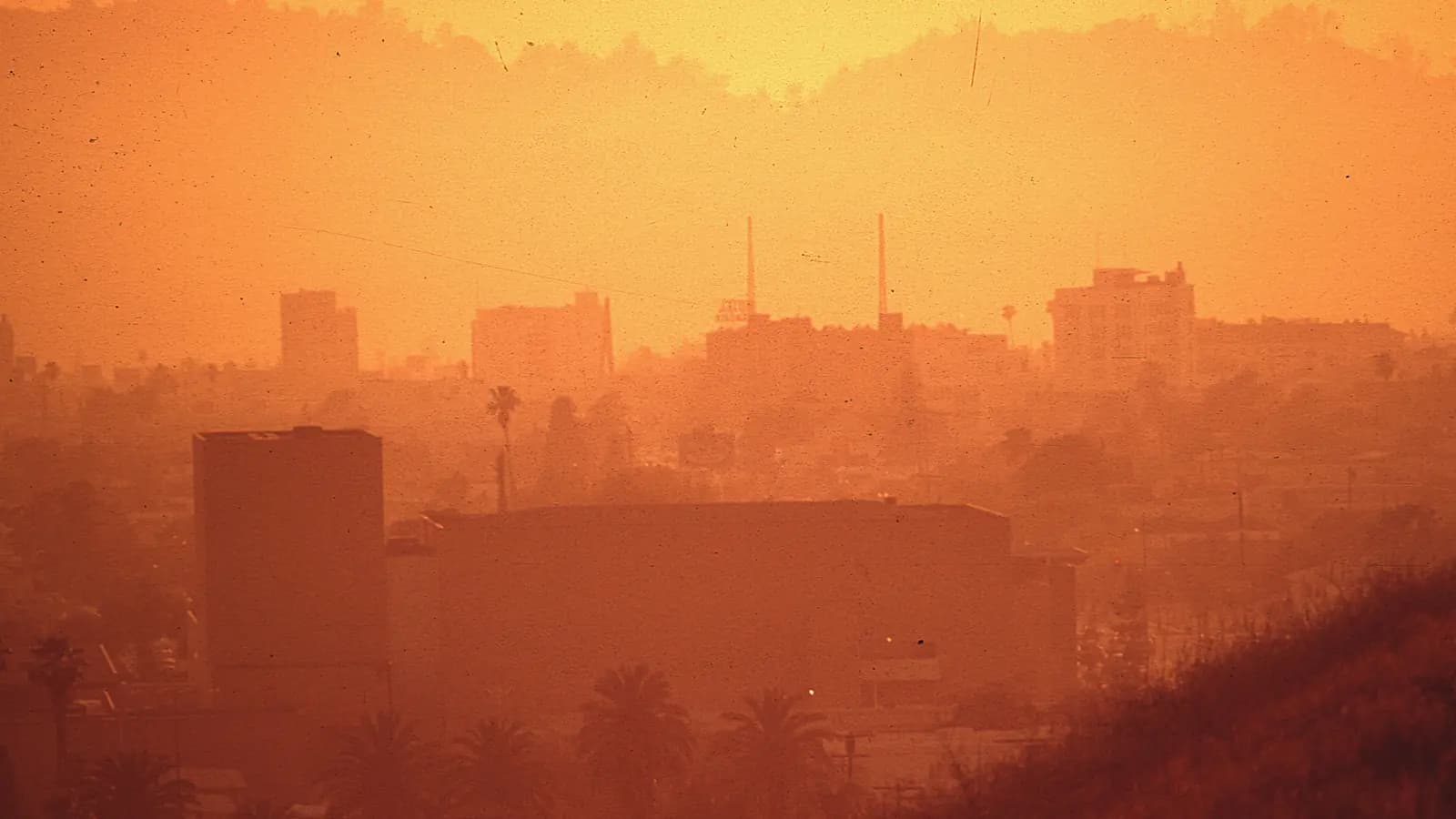Smog hangs over Los Angeles under an orange sky, May 1972