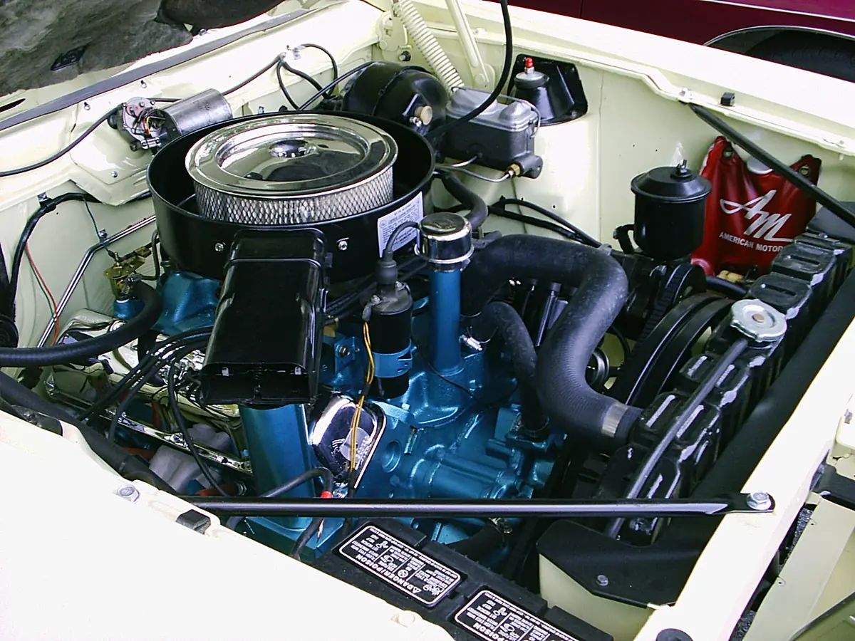 The V8 engine bay of a 1970 AMC Javelin, a pre-1976 car that is exempt from California smog checks
