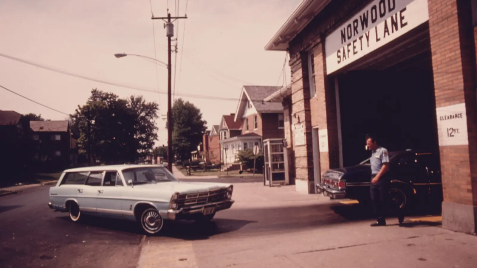 A station wagon waits outside the Norwood Safety Lane inspection station